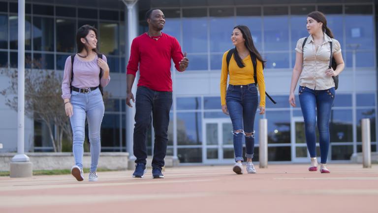 Students walking in front of college campus