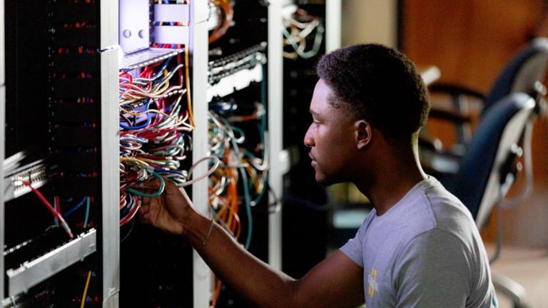 Technician working on computer server