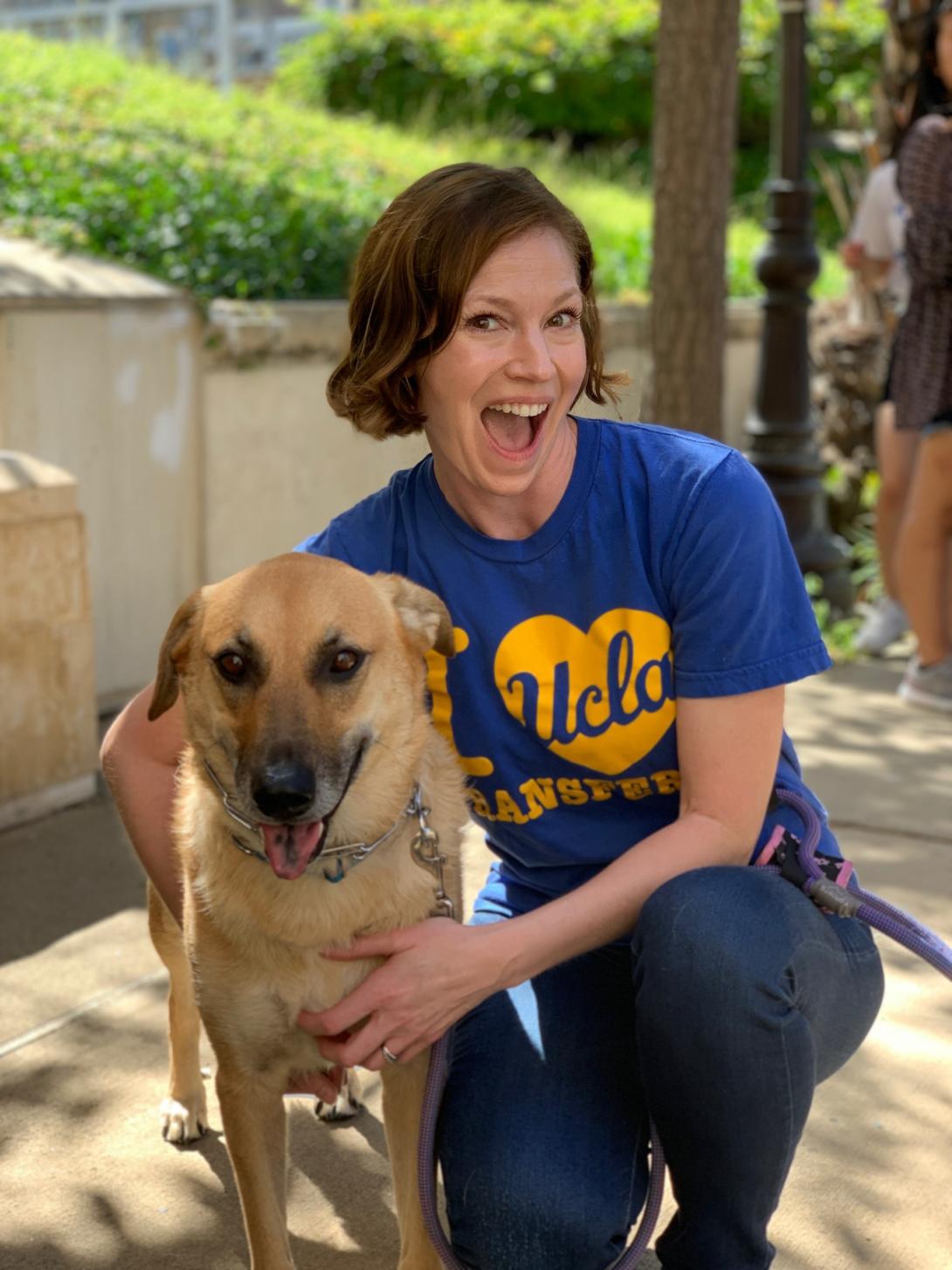 Heather poses with @MollytheTransferDog. Follow their adventures on Instagram to learn more about community colleges nationwide.